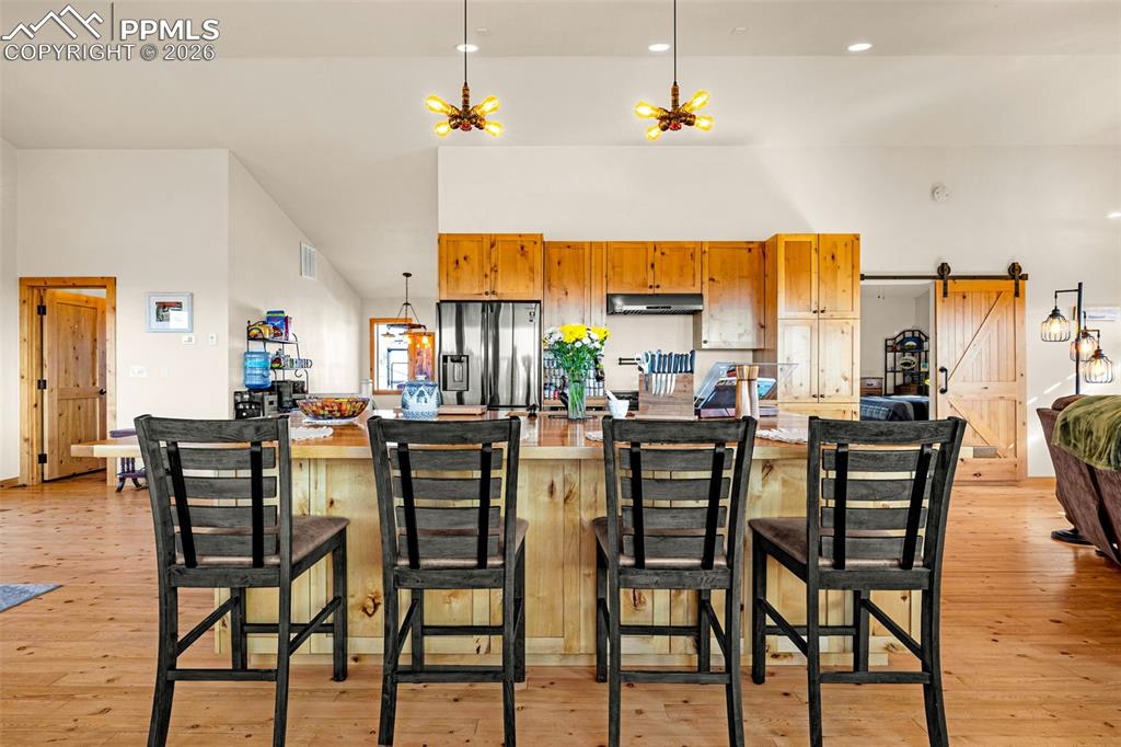 8480 Delaware Road Colorado Springs, CO 80926 - Photo 7 of 49 Kitchen with large island and breakfast bar