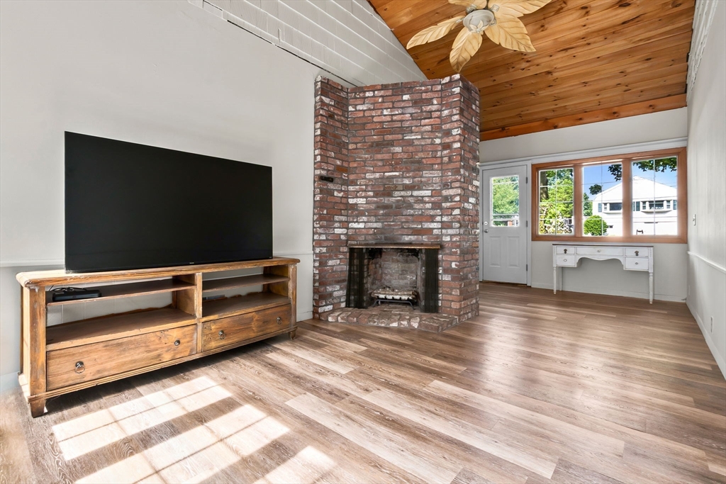 38 Pickering Street Danvers, MA 01923 - Photo 14 of 39 a living room with furniture and a flat screen tv