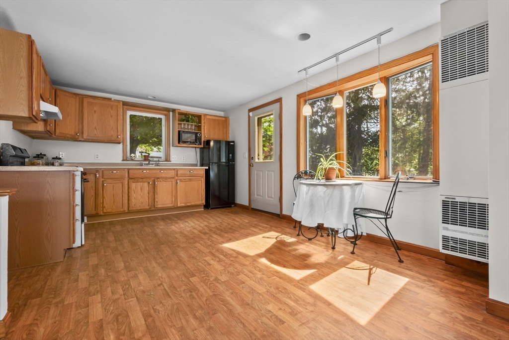 38 Pickering Street Danvers, MA 01923 - Photo 20 of 39 a view of an empty room with a window and wooden floor