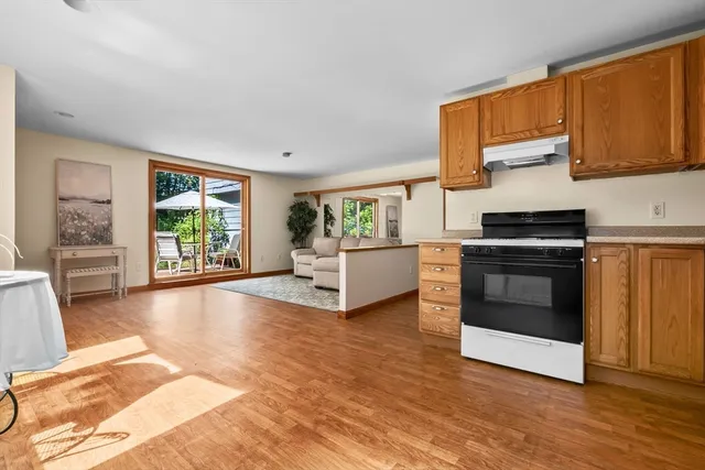 a living room with furniture and large window