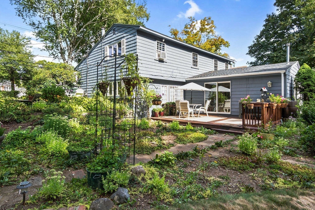 38 Pickering Street Danvers, MA 01923 - Photo 35 of 39 a backyard of a house with yard and outdoor seating