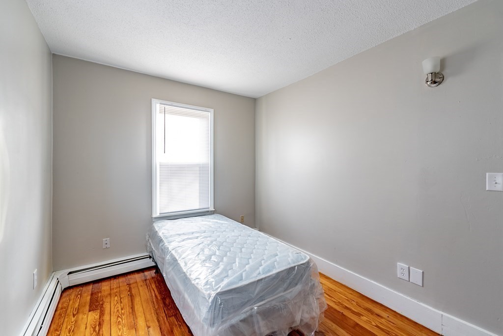 254-256 Main Street Springfield, MA 01151 - Photo 11 of 34 a view of an empty room and window