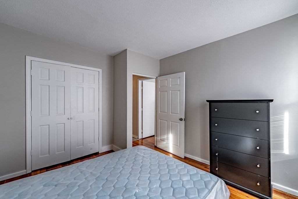 254-256 Main Street Springfield, MA 01151 - Photo 16 of 34 a view of an empty room and wooden floor