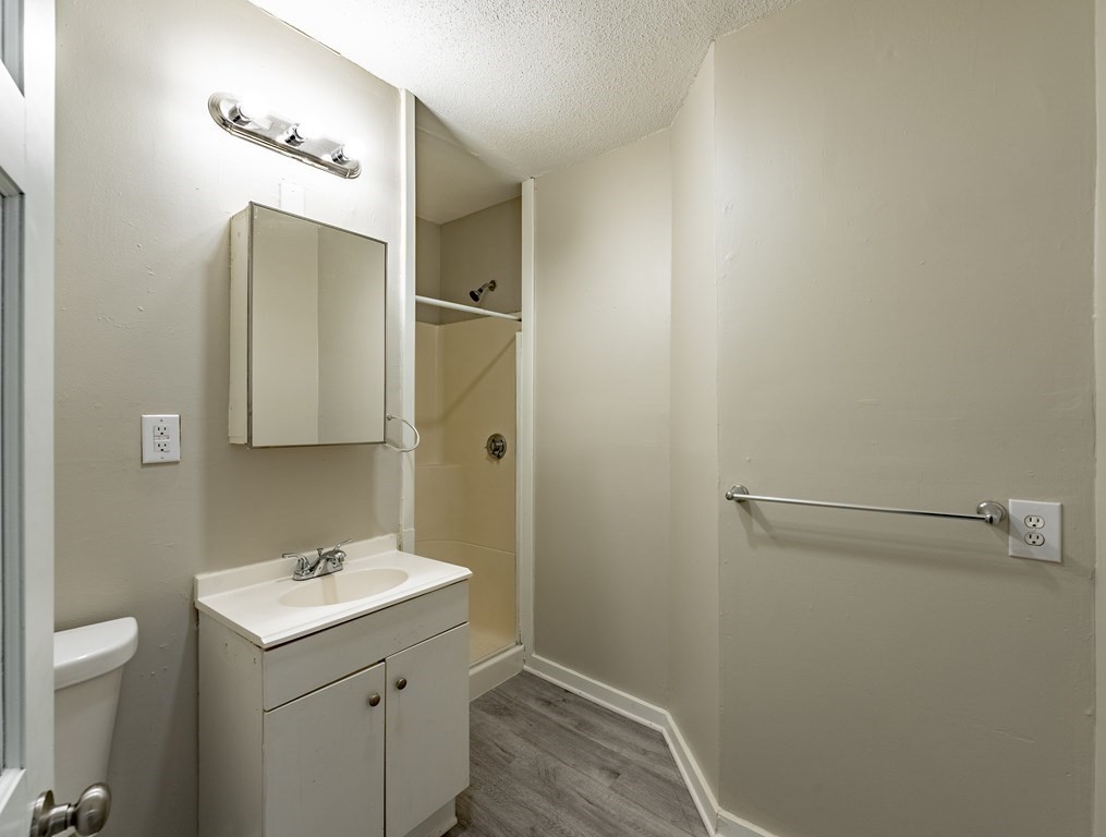 254-256 Main Street Springfield, MA 01151 - Photo 23 of 34 a bathroom with a sink toilet and shower