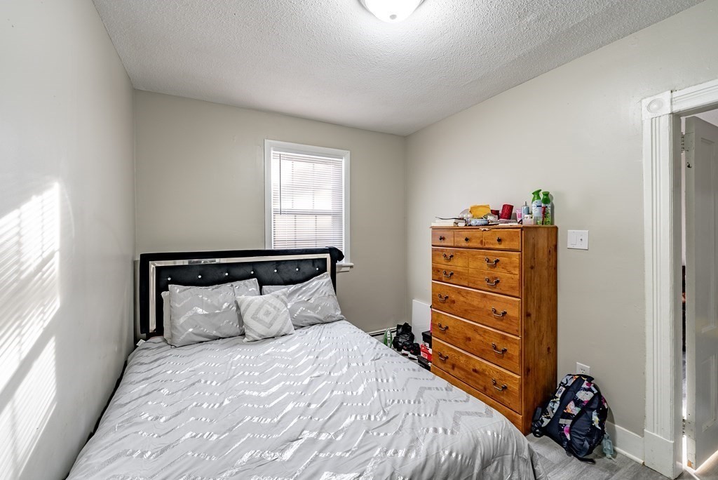 254-256 Main Street Springfield, MA 01151 - Photo 10 of 34 a bedroom with a bed and a closet