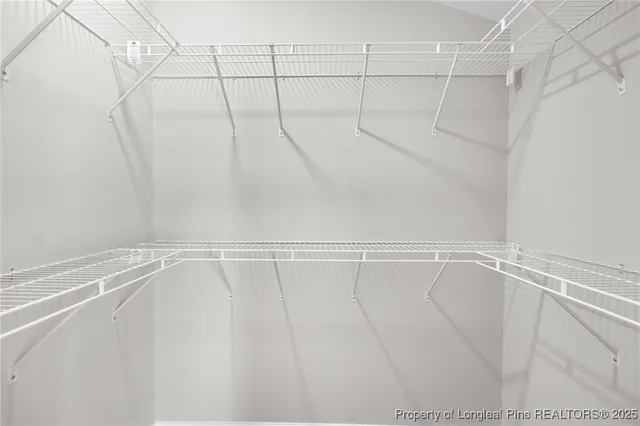 a view of a room with racks on the wall