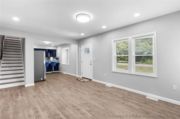 a view of an empty room with a window
