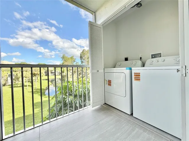 a view of a room with dryer and washer
