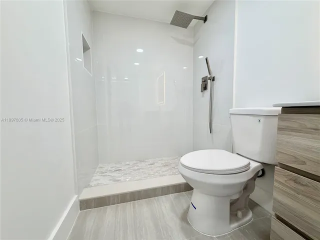 a bathroom with a sink and toilet