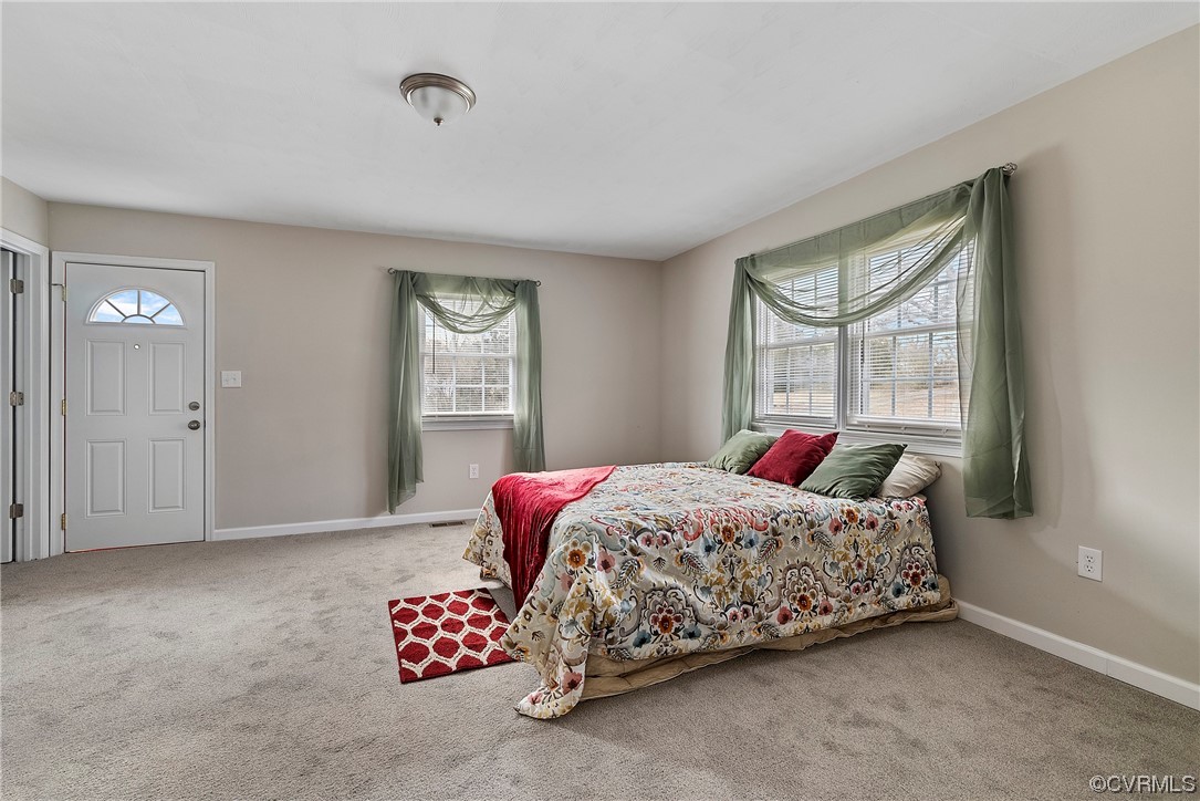 988 3 Notch Road Kents Store, VA 23084 - Photo 11 of 32 Carpeted bedroom with multiple windows, master bat