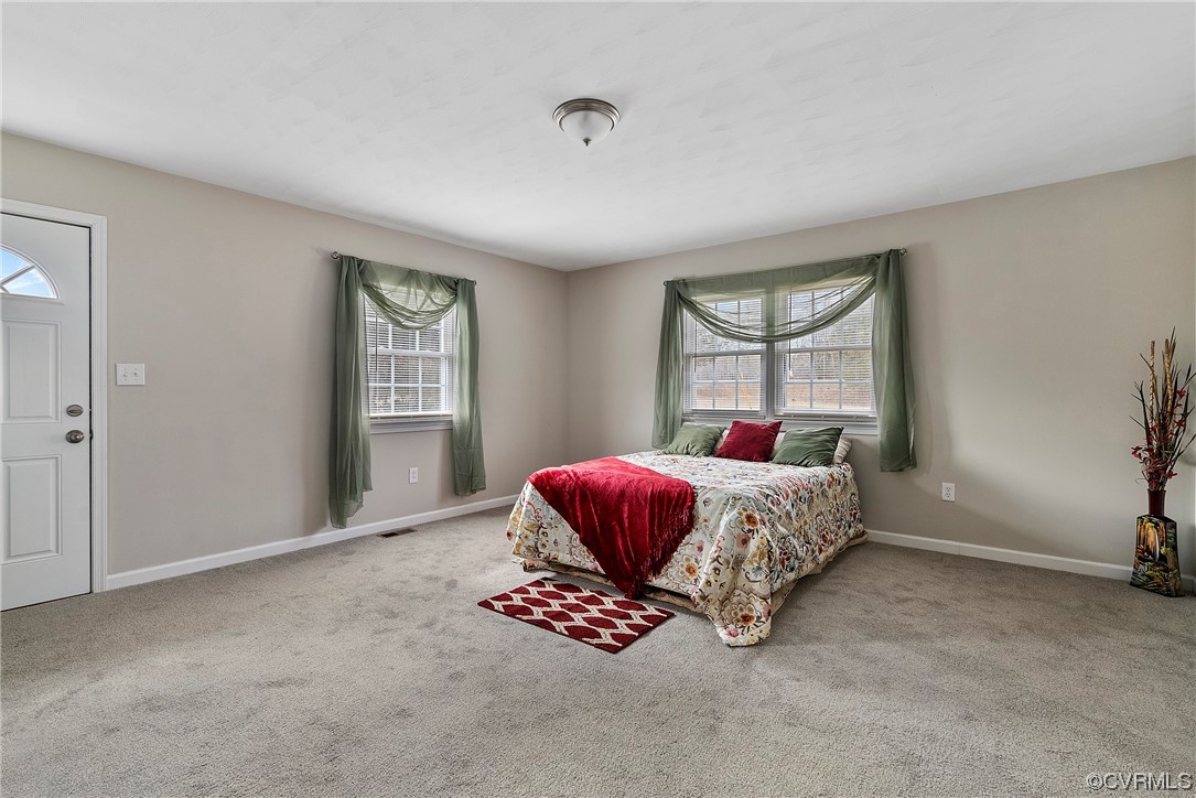 988 3 Notch Road Kents Store, VA 23084 - Photo 13 of 32 Carpeted bedroom featuring multiple windows