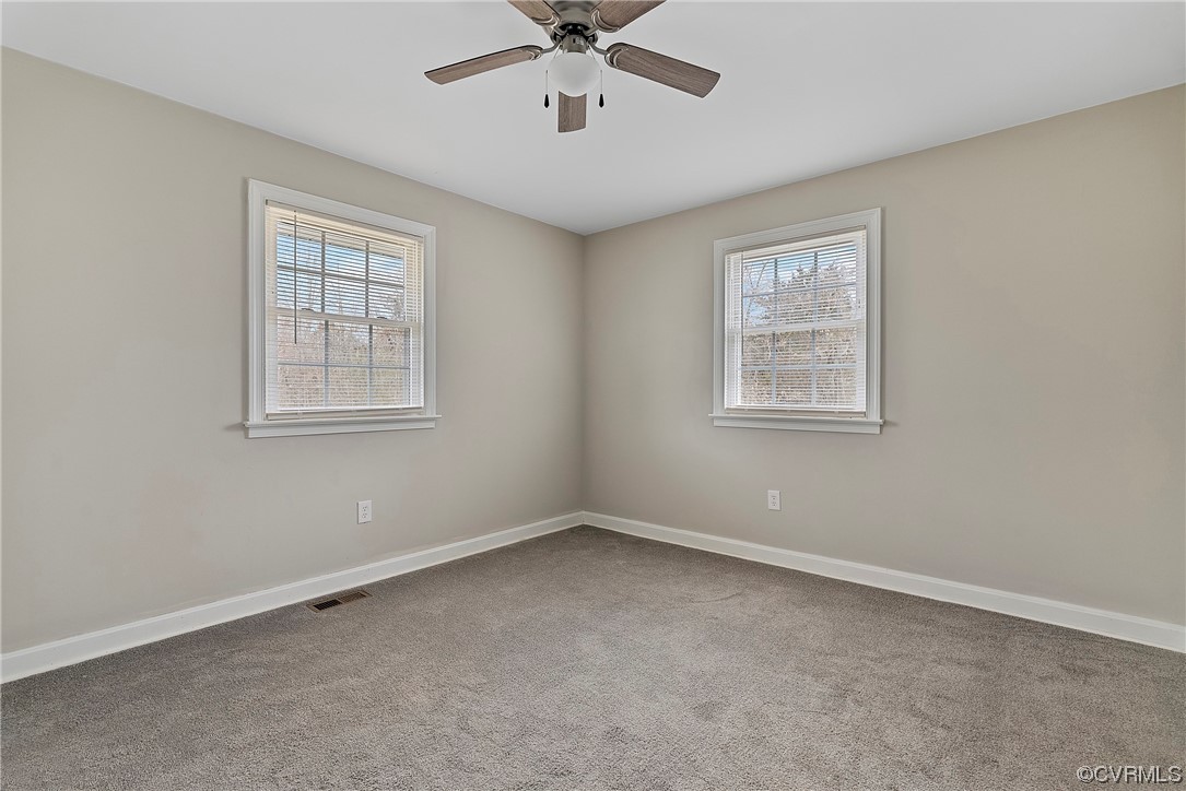 988 3 Notch Road Kents Store, VA 23084 - Photo 19 of 32 Carpeted spare room with ceiling fan and a healthy