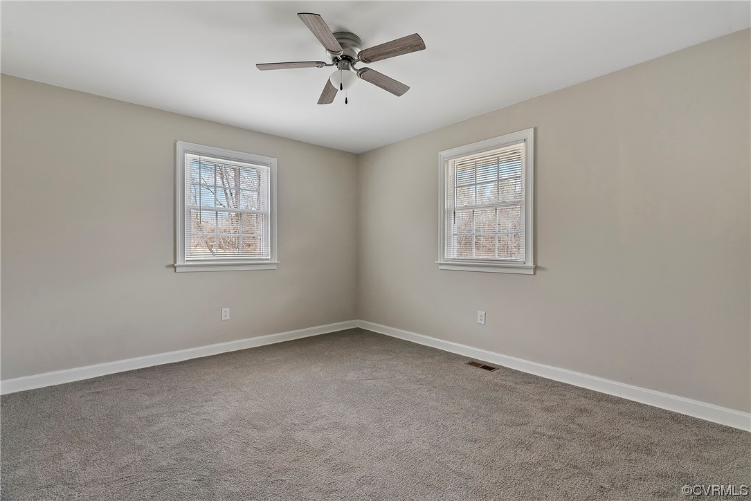 988 3 Notch Road Kents Store, VA 23084 - Photo 23 of 32 Carpeted spare room featuring plenty of natural li