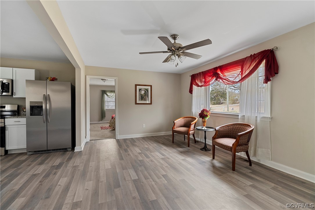 988 3 Notch Road Kents Store, VA 23084 - Photo 4 of 32 Family room featuring LPV flooring and ceiling fan