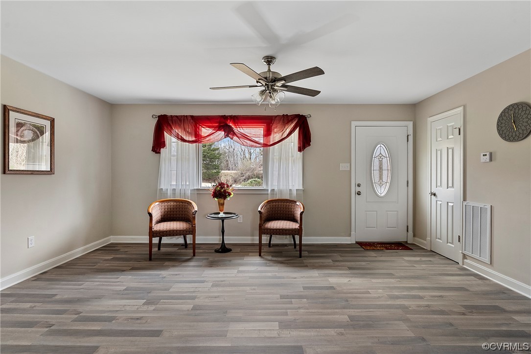 988 3 Notch Road Kents Store, VA 23084 - Photo 6 of 32 Family room with LPV Flooring and ceiling fan