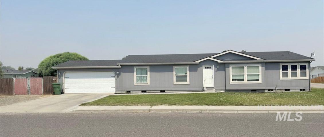 100 Ellsworth Street Vale, OR 97918 - Photo 1 of 25 Single-story residence featuring gray siding and a dark shingle roof