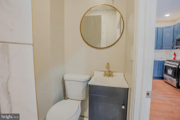 a kitchen with a sink cabinets and a window
