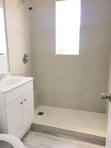 a bathroom with a bathtub and a sink