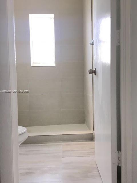 342 Northwest 84th Terrace, Unit 342 Miami, FL 33150 - Photo 5 of 9 a bathroom with a shower