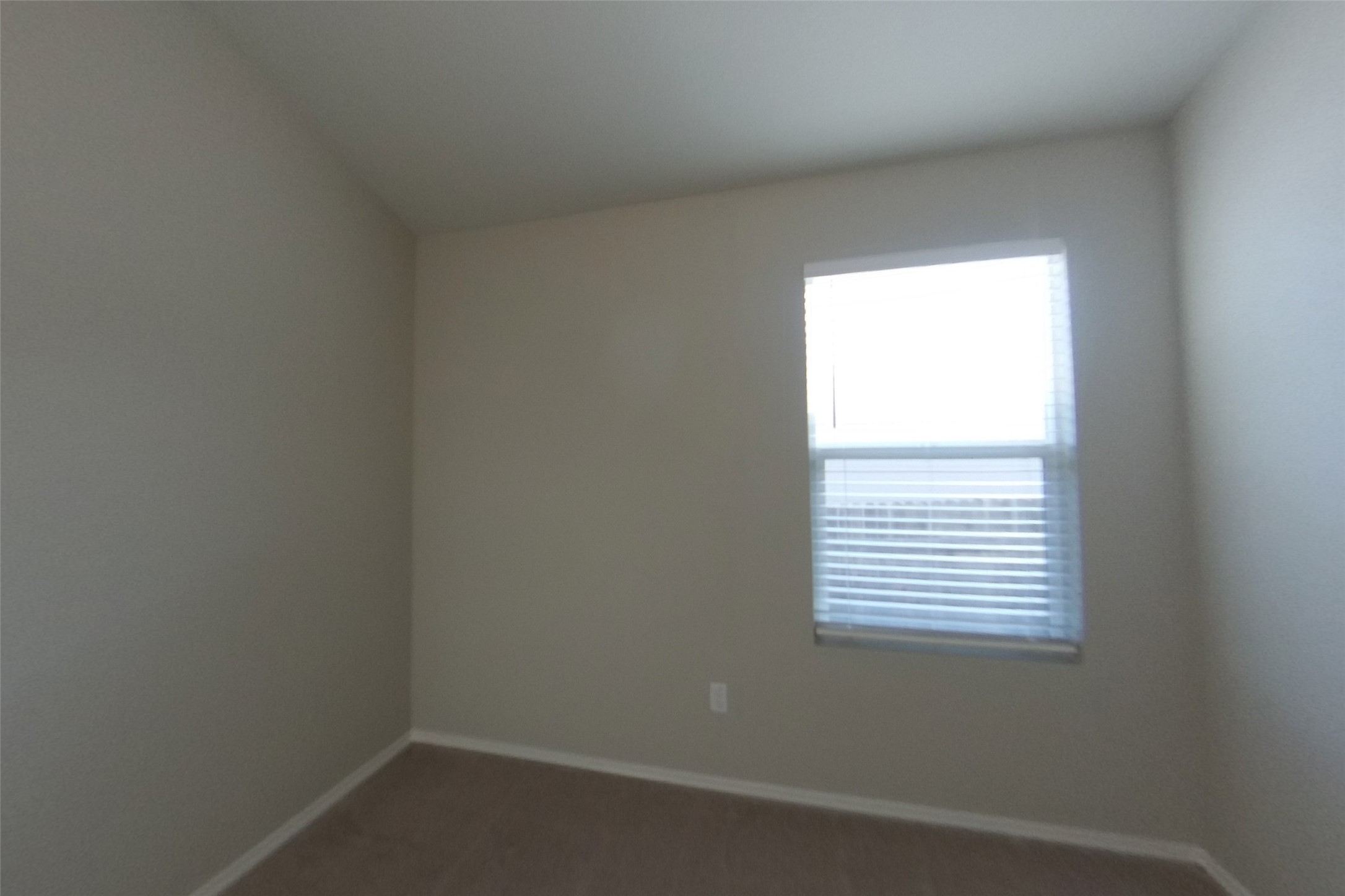 3525 Catlett Crk Road Georgetown, TX 78626 - Photo 11 of 16 Natural light streams through a large window into this carpeted bedroom.