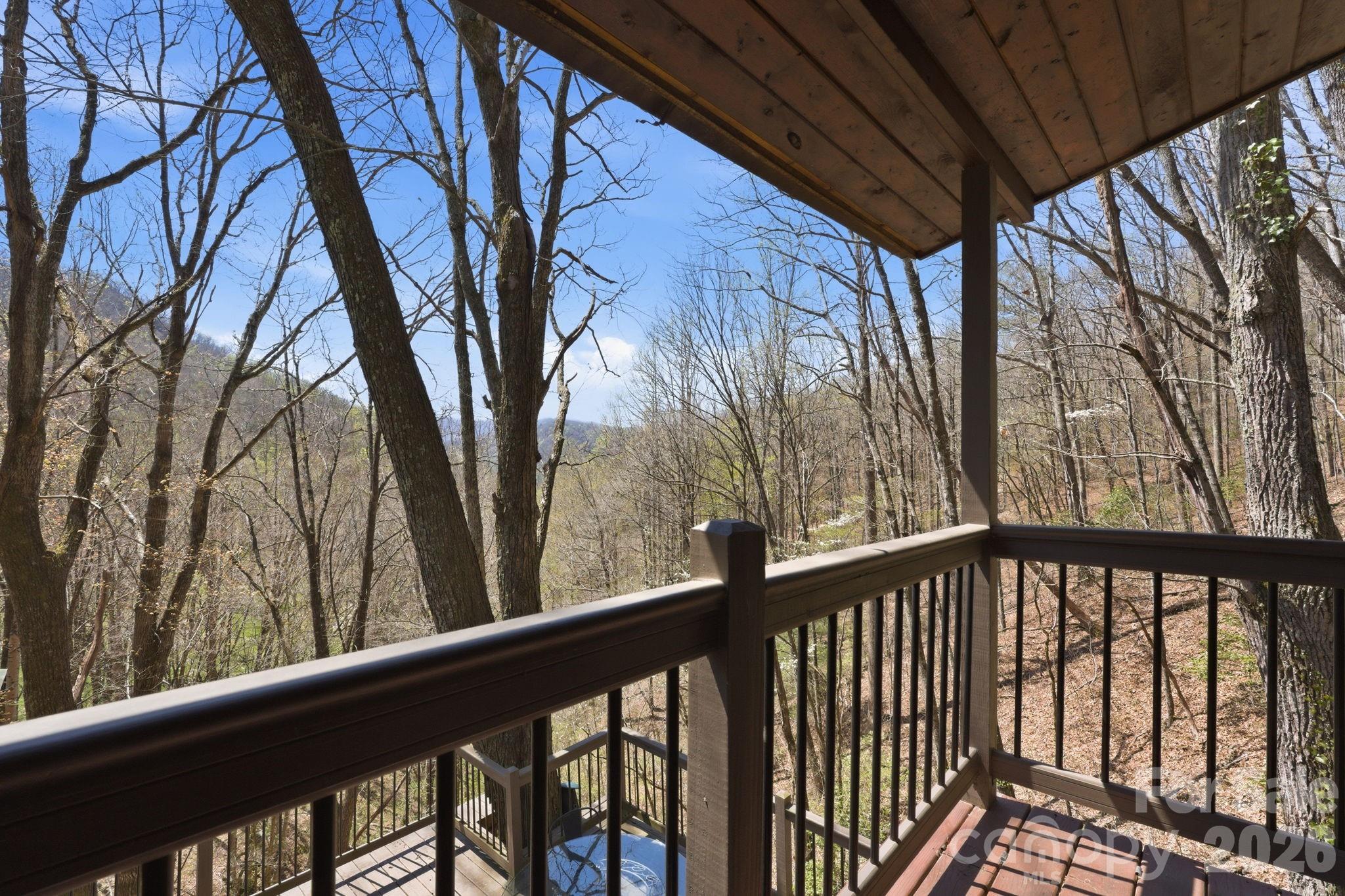 1837 East Alarka Road Bryson City, NC 28713 - Photo 11 of 39 a view of trees and trees from a balcony
