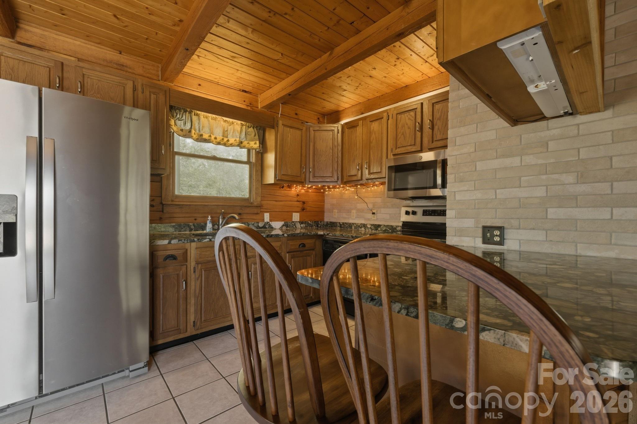 1837 East Alarka Road Bryson City, NC 28713 - Photo 17 of 34 a view of a kitchen with a sink and cabinets
