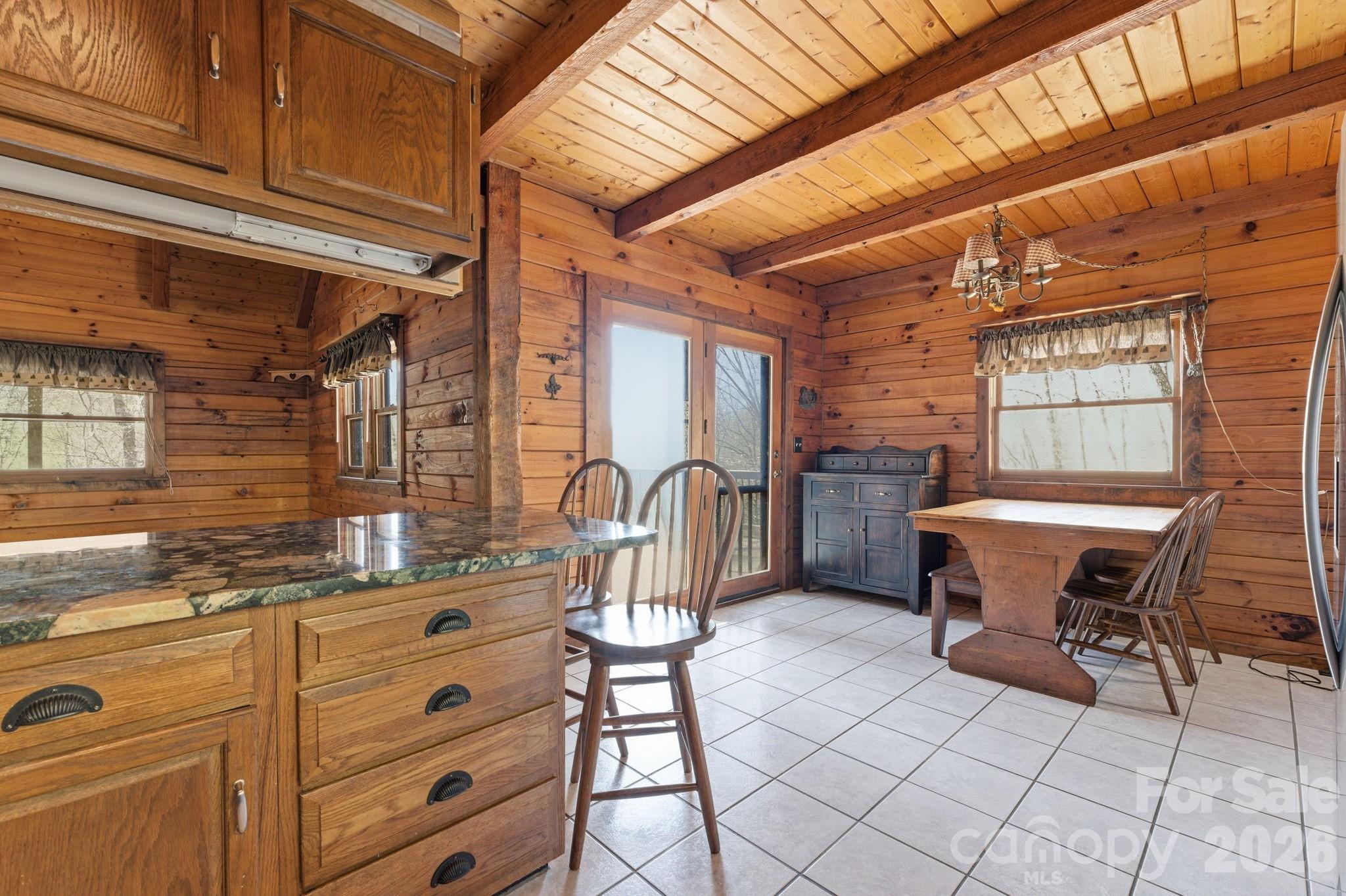 1837 East Alarka Road Bryson City, NC 28713 - Photo 19 of 34 a view of a dining room with furniture
