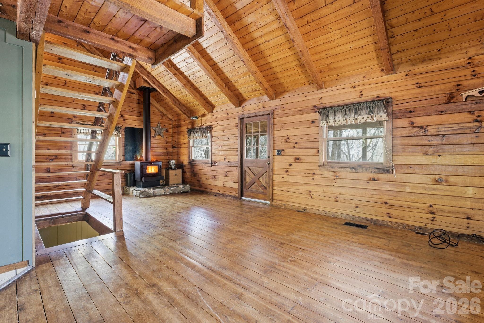 1837 East Alarka Road Bryson City, NC 28713 - Photo 21 of 39 a view of a porch with wooden floor and a gate