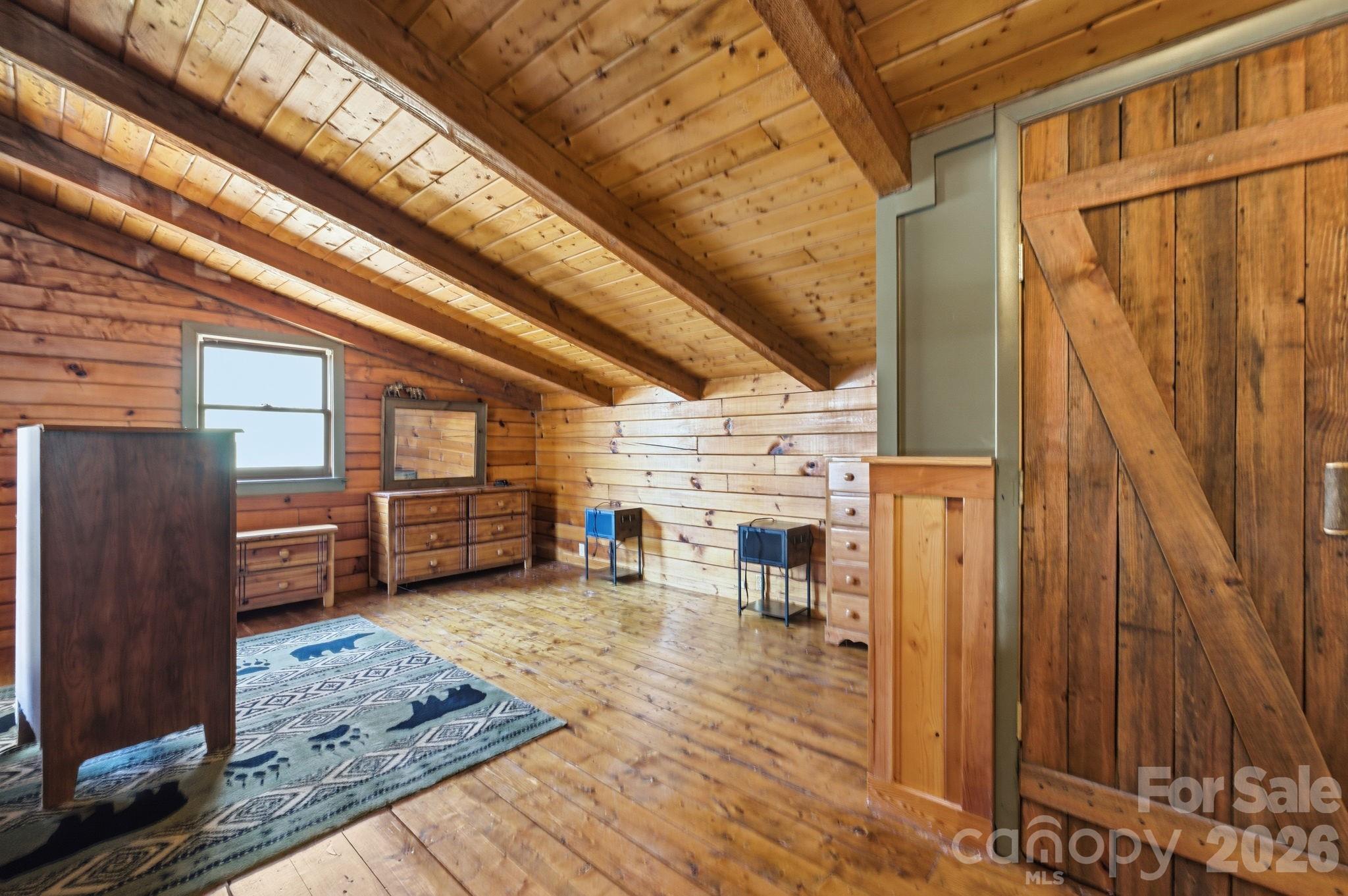 1837 East Alarka Road Bryson City, NC 28713 - Photo 28 of 34 a view of a livingroom with furniture and a rug