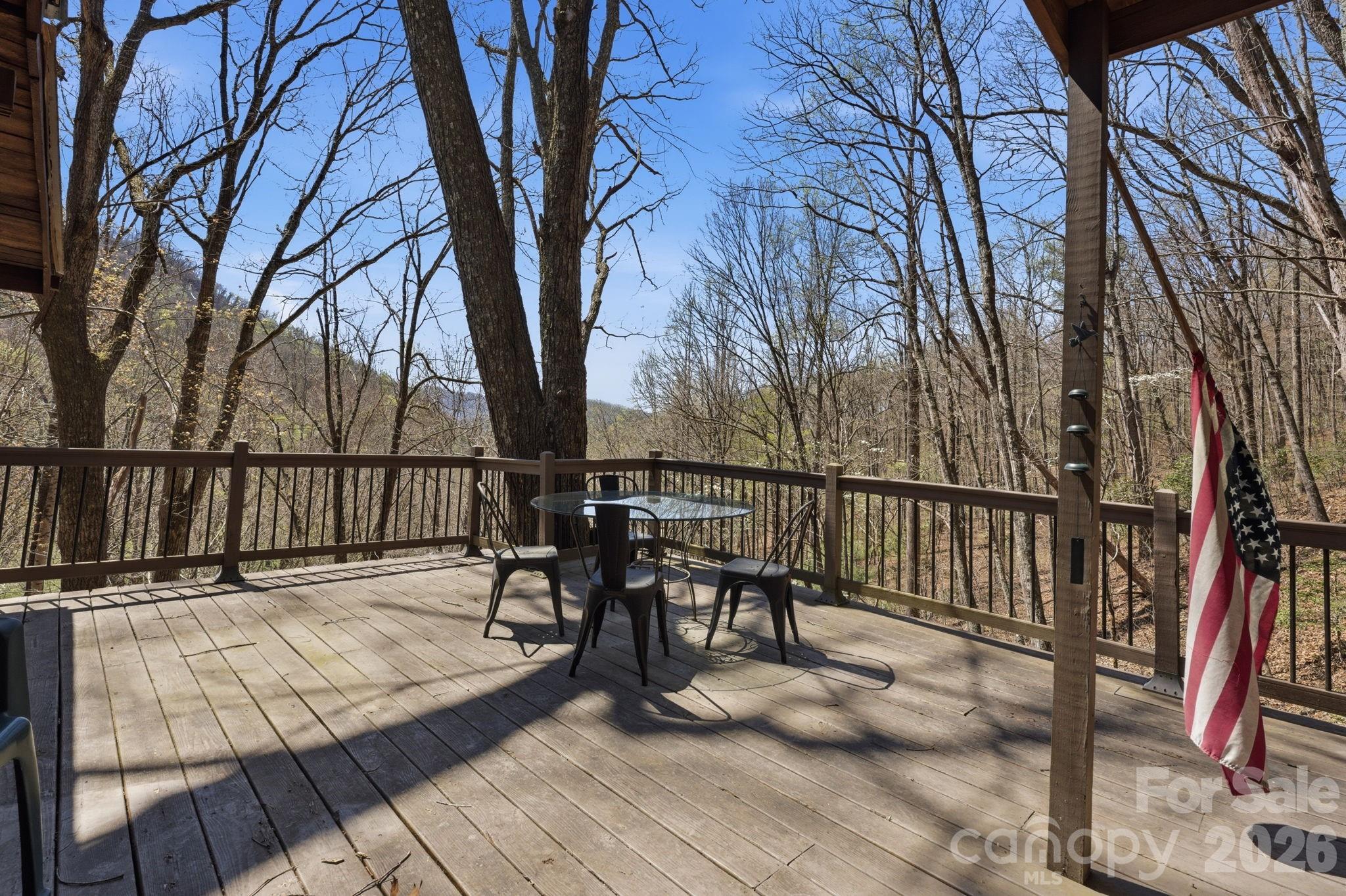 1837 East Alarka Road Bryson City, NC 28713 - Photo 5 of 34 a view of balcony with wooden floor and outdoor seating