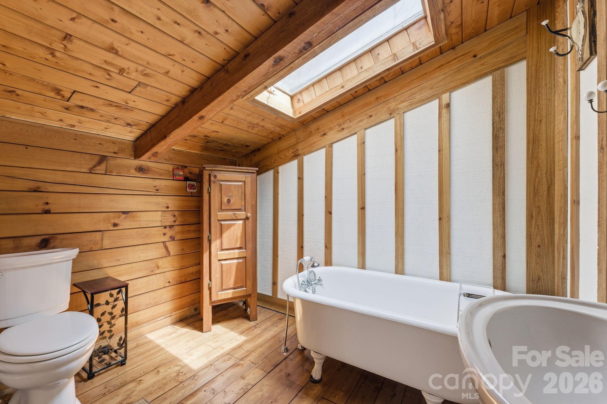 1837 East Alarka Road Bryson City, NC 28713 - Photo 10 of 39 a bathroom with a sink and toilet