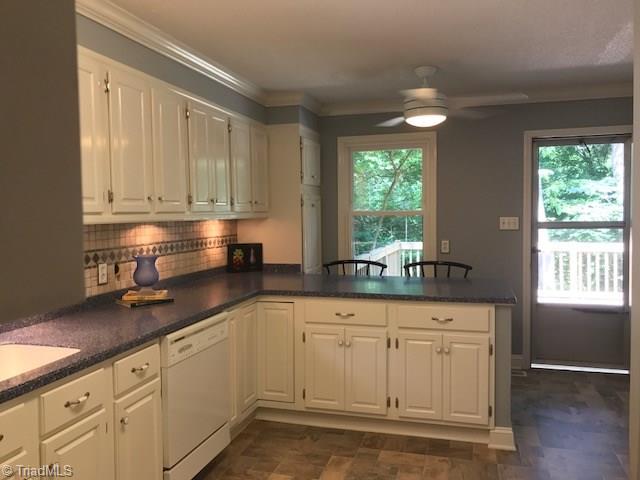 627 Barrocliff Road Clemmons, NC 27012 - Photo 6 of 28 Plenty of space for bar stools at counter then jump out to the spacious deck from kitchen and den
