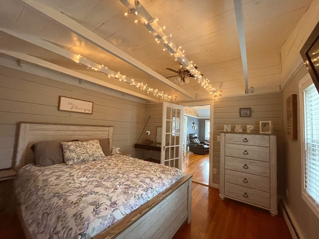 95 Pleasant Circle Canton, MA 02021 - Photo 11 of 17 a bedroom with a bed and a chandelier