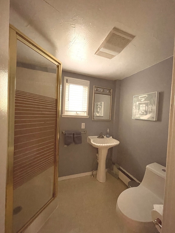 95 Pleasant Circle Canton, MA 02021 - Photo 15 of 17 a bathroom with a sink toilet and a mirror