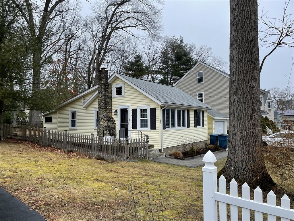 95 Pleasant Circle Canton, MA 02021 - Photo 2 of 17 a front view of house with yard covered in snow