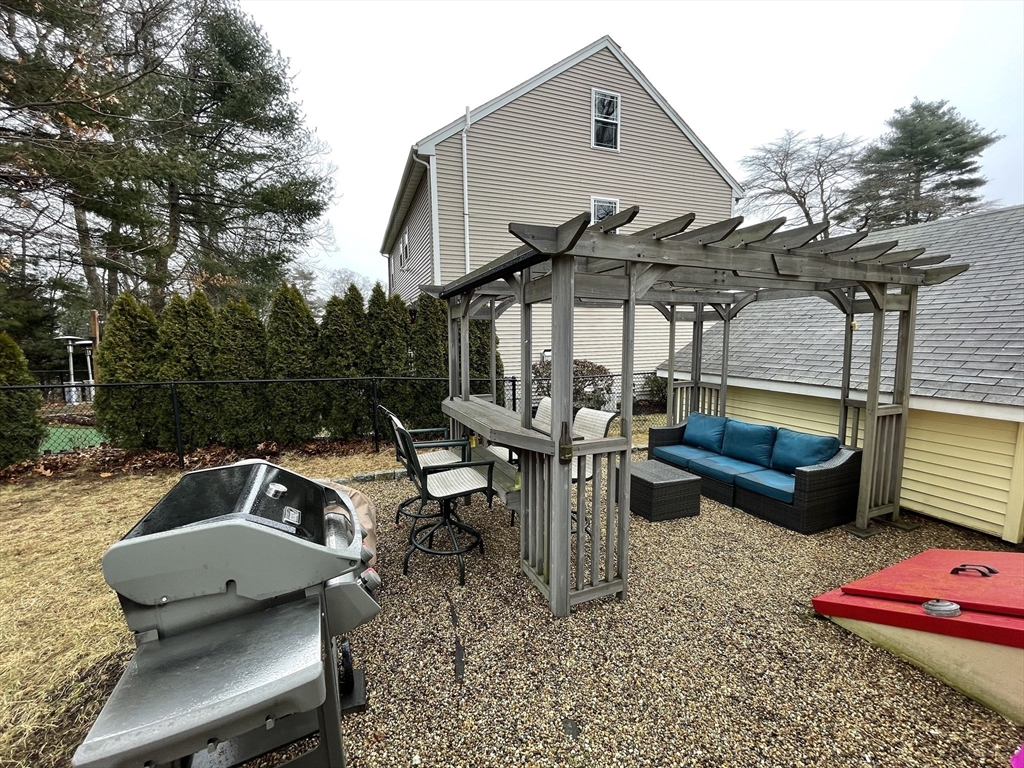 95 Pleasant Circle Canton, MA 02021 - Photo 3 of 17 a front view of a house with garden and chairs