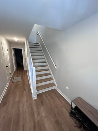 a view of a hallway with stairs