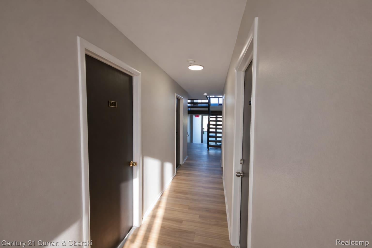 6035 Southfield Road, Unit 12 Detroit, MI 48228 - Photo 2 of 10 Corridor with light wood-type flooring and recessed lighting
