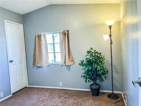 a view of entryway with paintings on the wall