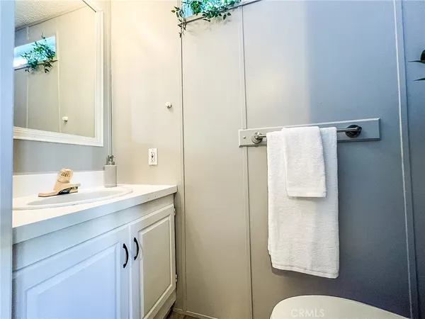a bathroom with a sink and mirror