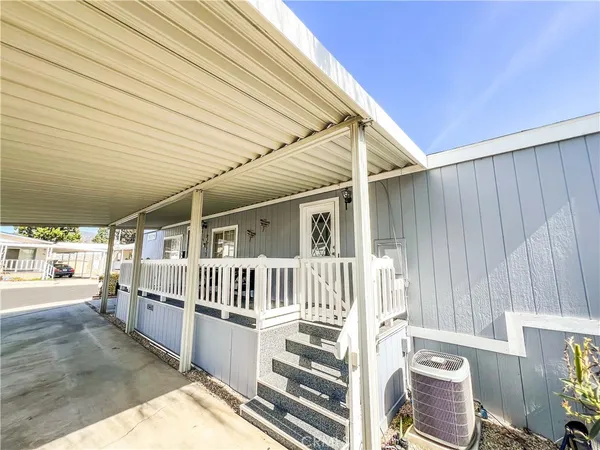a view of outdoor space with deck and furniture