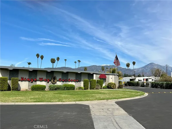 a view of a table and chairs in the garden