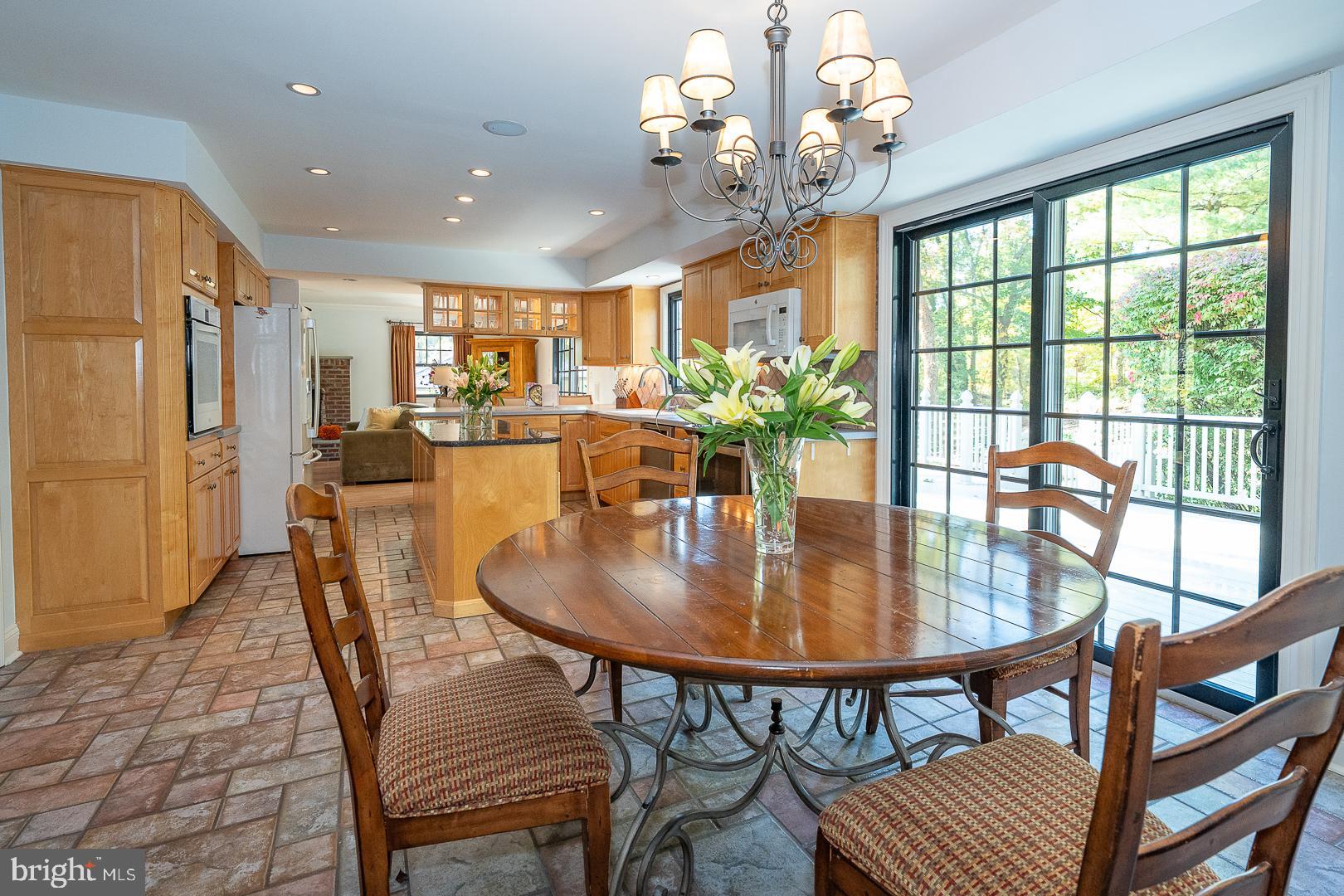 800 Maple Glen Lane Wayne, PA 19087 - Photo 13 of 52 a dining room with furniture a rug and a chandelier