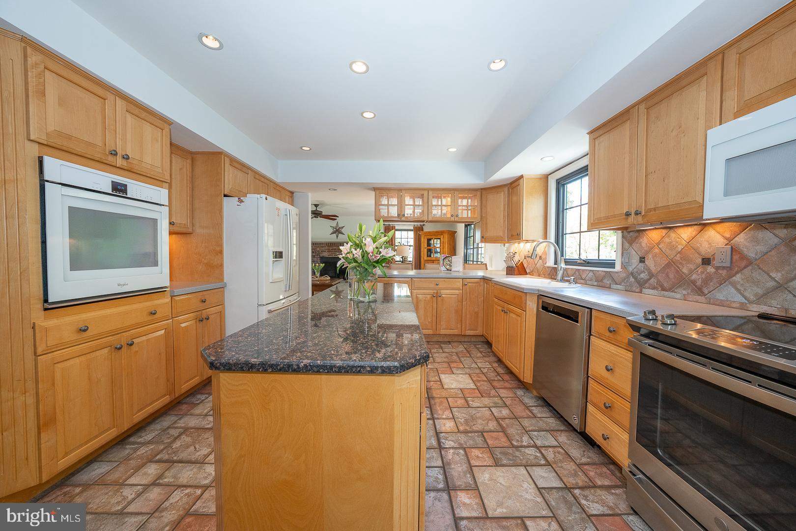 800 Maple Glen Lane Wayne, PA 19087 - Photo 15 of 52 a kitchen with stainless steel appliances granite countertop a sink stove and cabinets