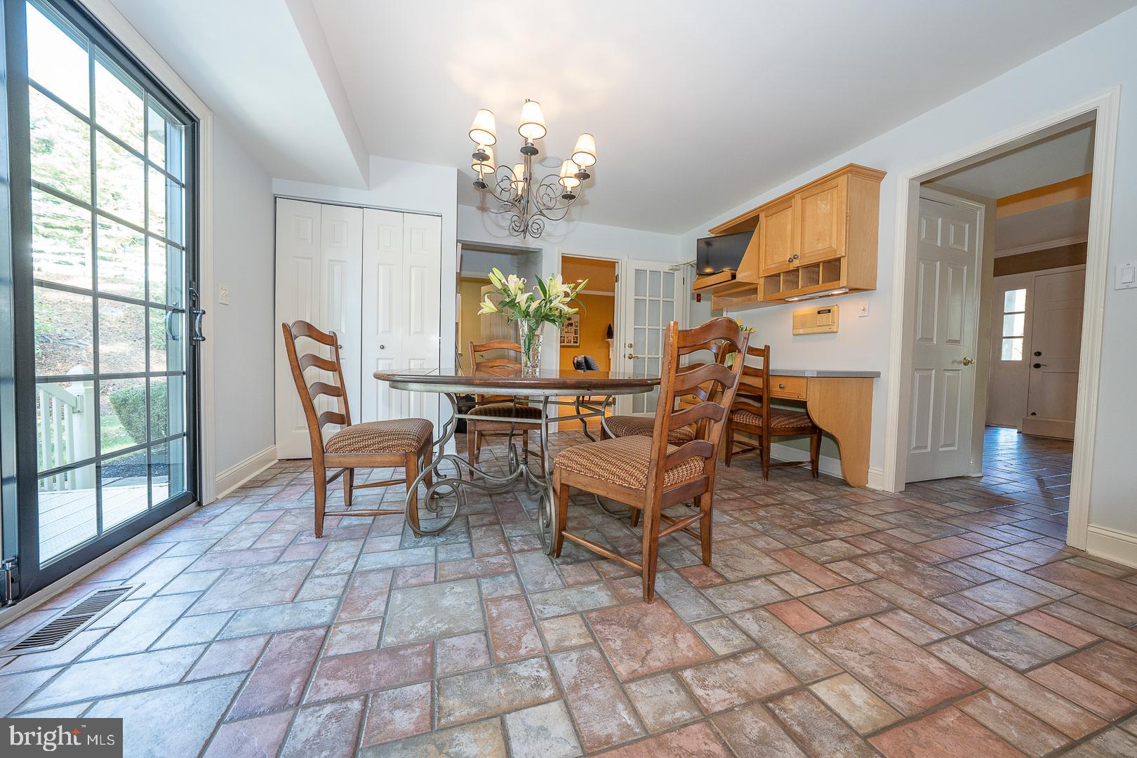 800 Maple Glen Lane Wayne, PA 19087 - Photo 22 of 52 a view of a dining room with furniture a chandelier and wooden floor