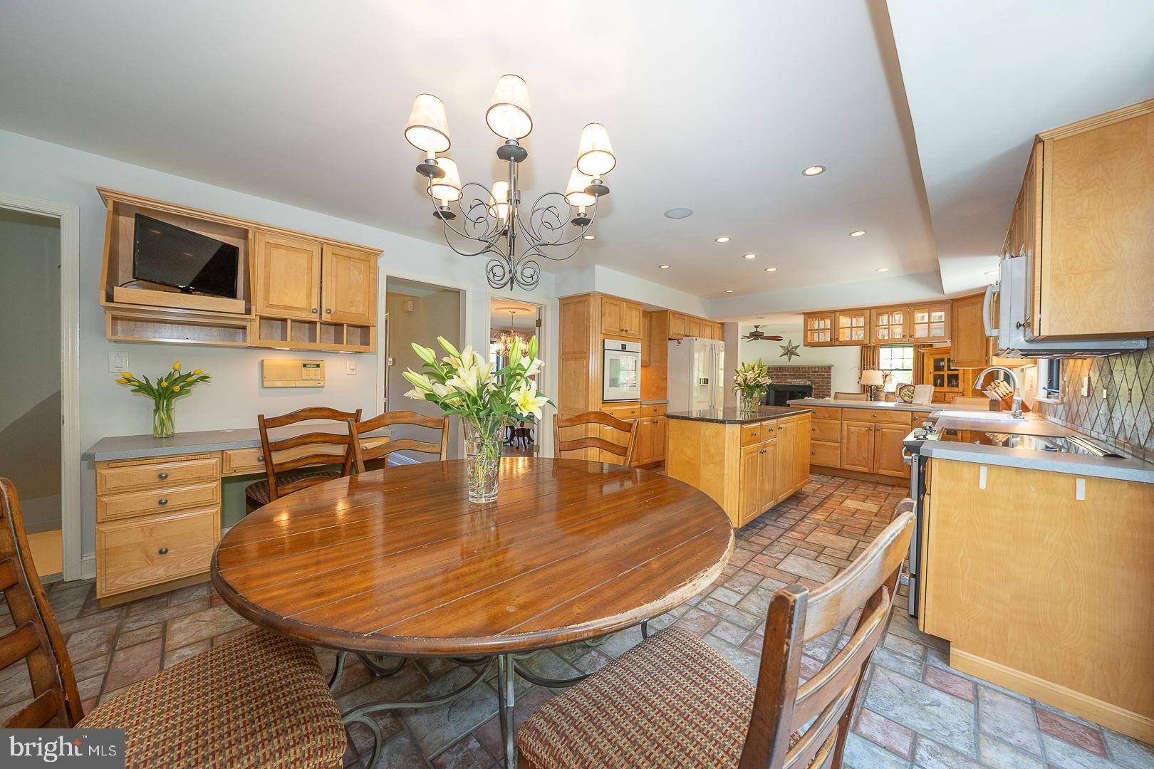 800 Maple Glen Lane Wayne, PA 19087 - Photo 23 of 52 a dining room filled chandelier and wooden floor