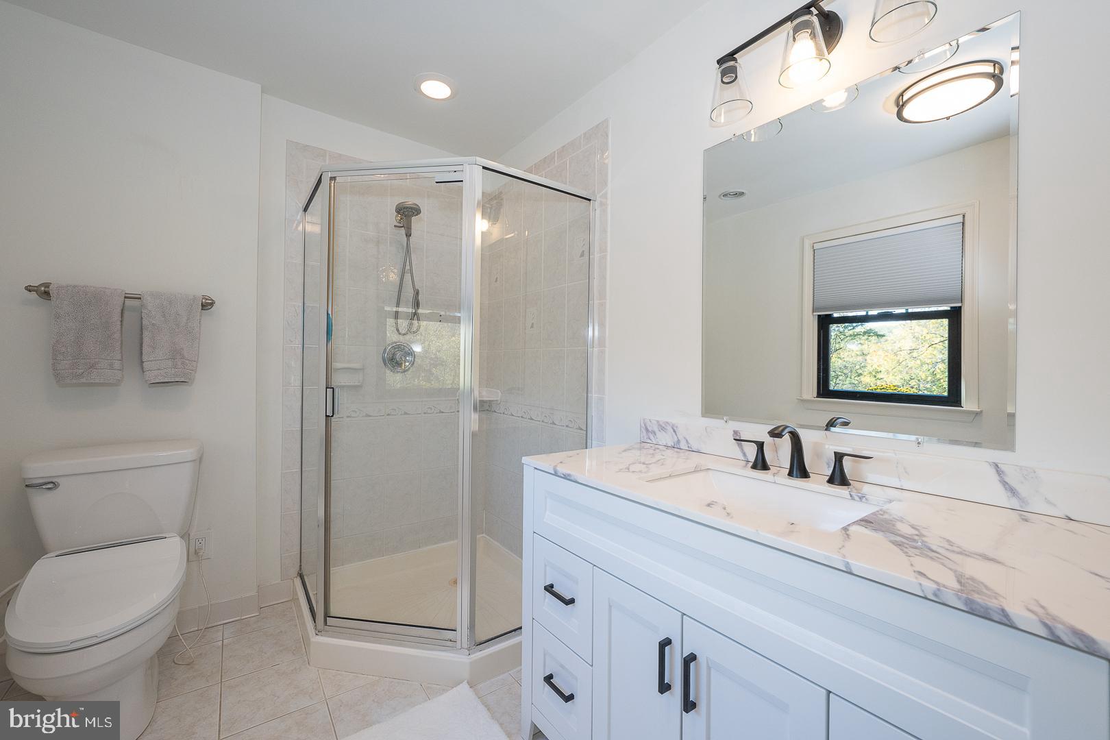 800 Maple Glen Lane Wayne, PA 19087 - Photo 31 of 52 a bathroom with a granite countertop sink toilet and shower