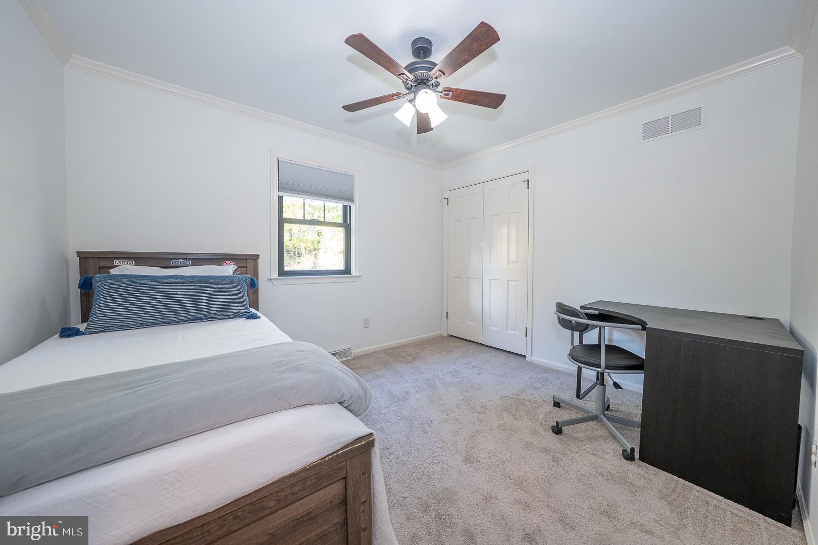 800 Maple Glen Lane Wayne, PA 19087 - Photo 34 of 52 a bedroom with a bed and a chandelier