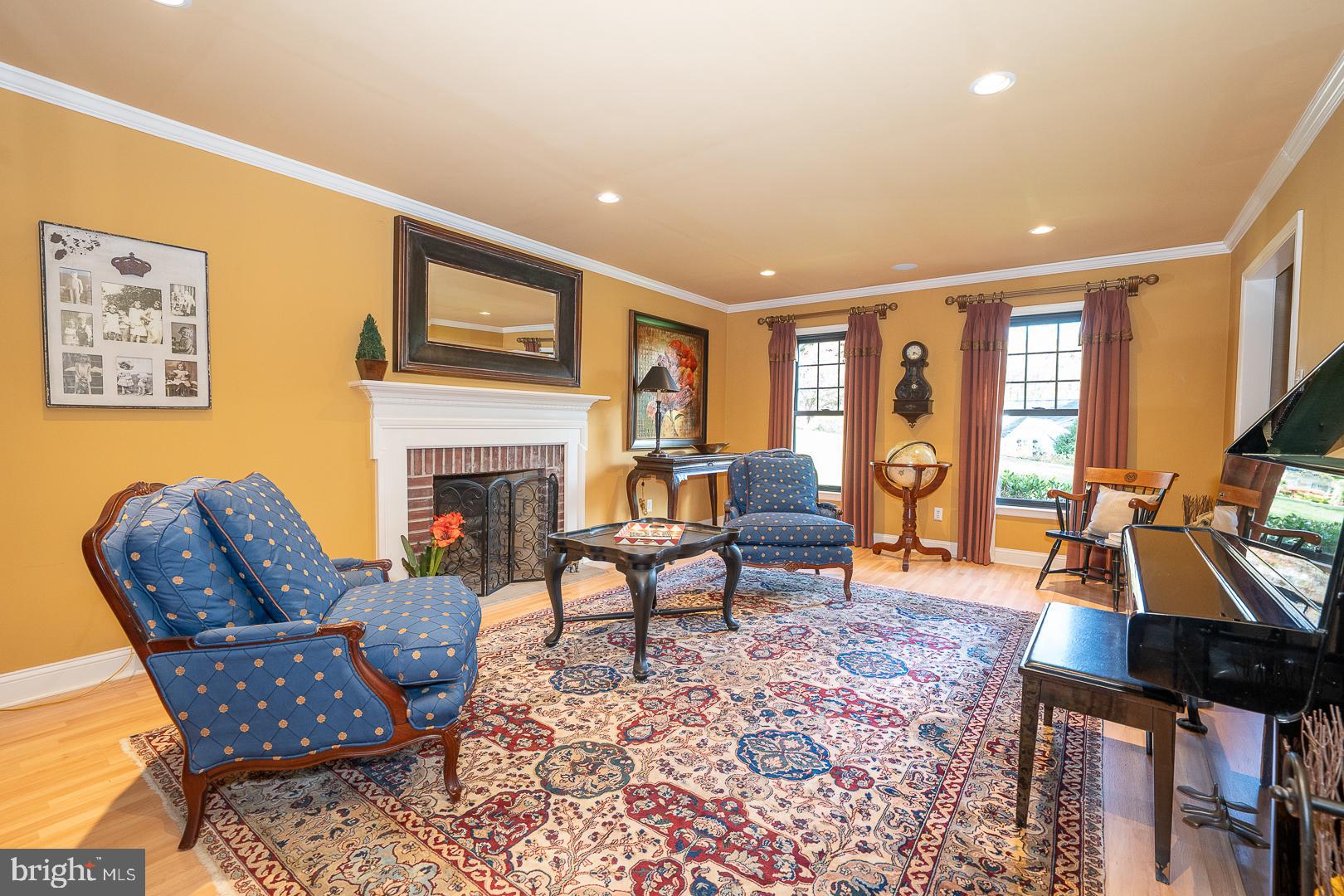 800 Maple Glen Lane Wayne, PA 19087 - Photo 6 of 52 a living room with furniture a fireplace and a flat screen tv