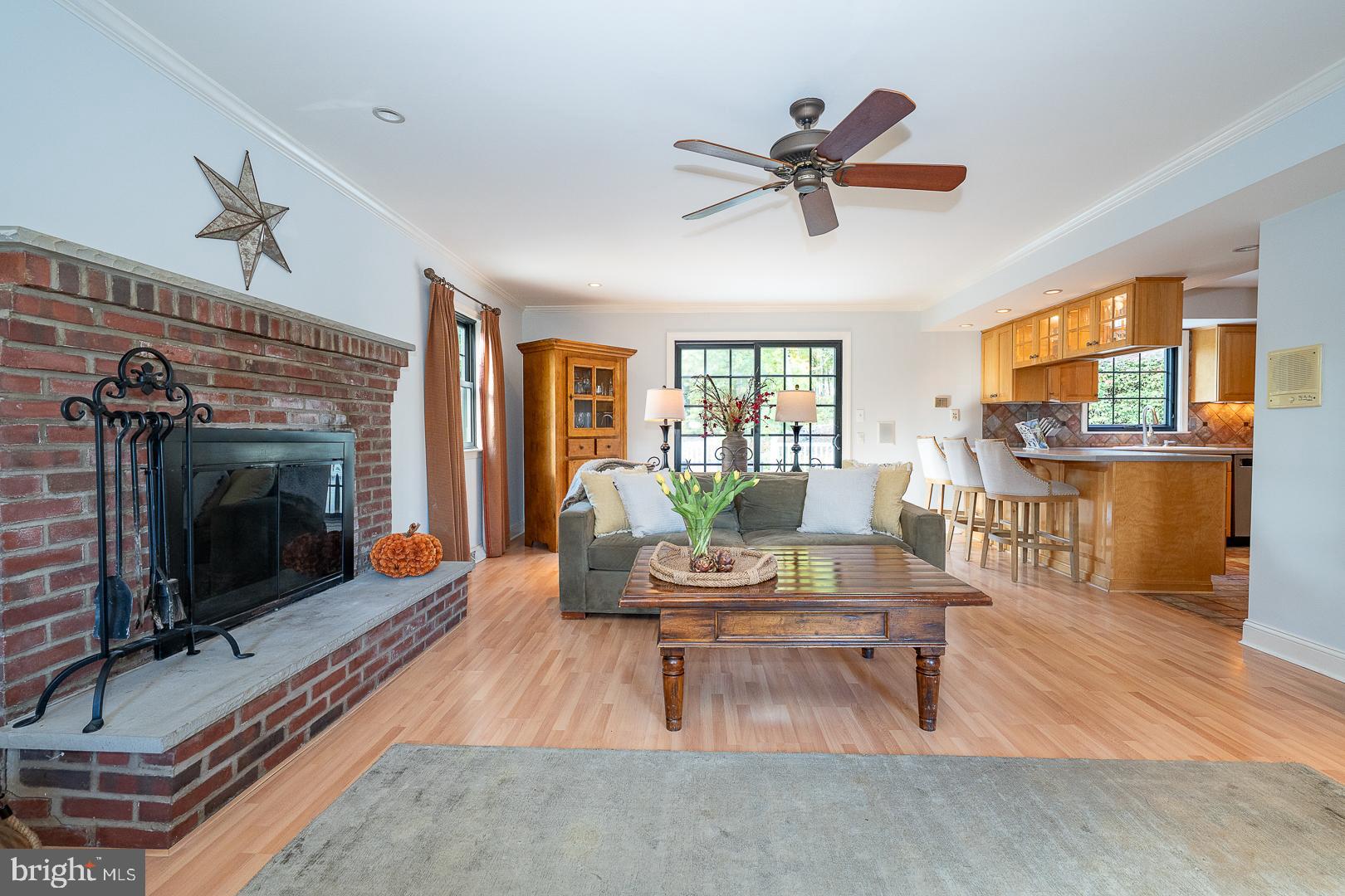 800 Maple Glen Lane Wayne, PA 19087 - Photo 10 of 52 a living room with furniture a flat screen tv and a fireplace